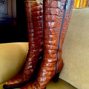 Donald Pliner boots.  Barely worn maybe 3 to 4 times. Great condition!